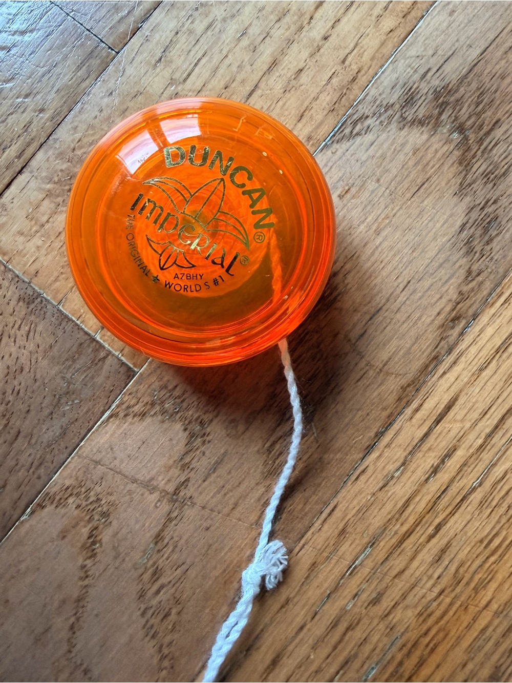 classic orange Duncan Imperial yo-yo, designed for beginners and looping tricks.